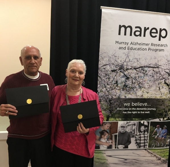 Monique and Gerard receiving an award from MAREP for their volunteer work